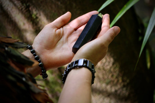 hands holding shungite wand