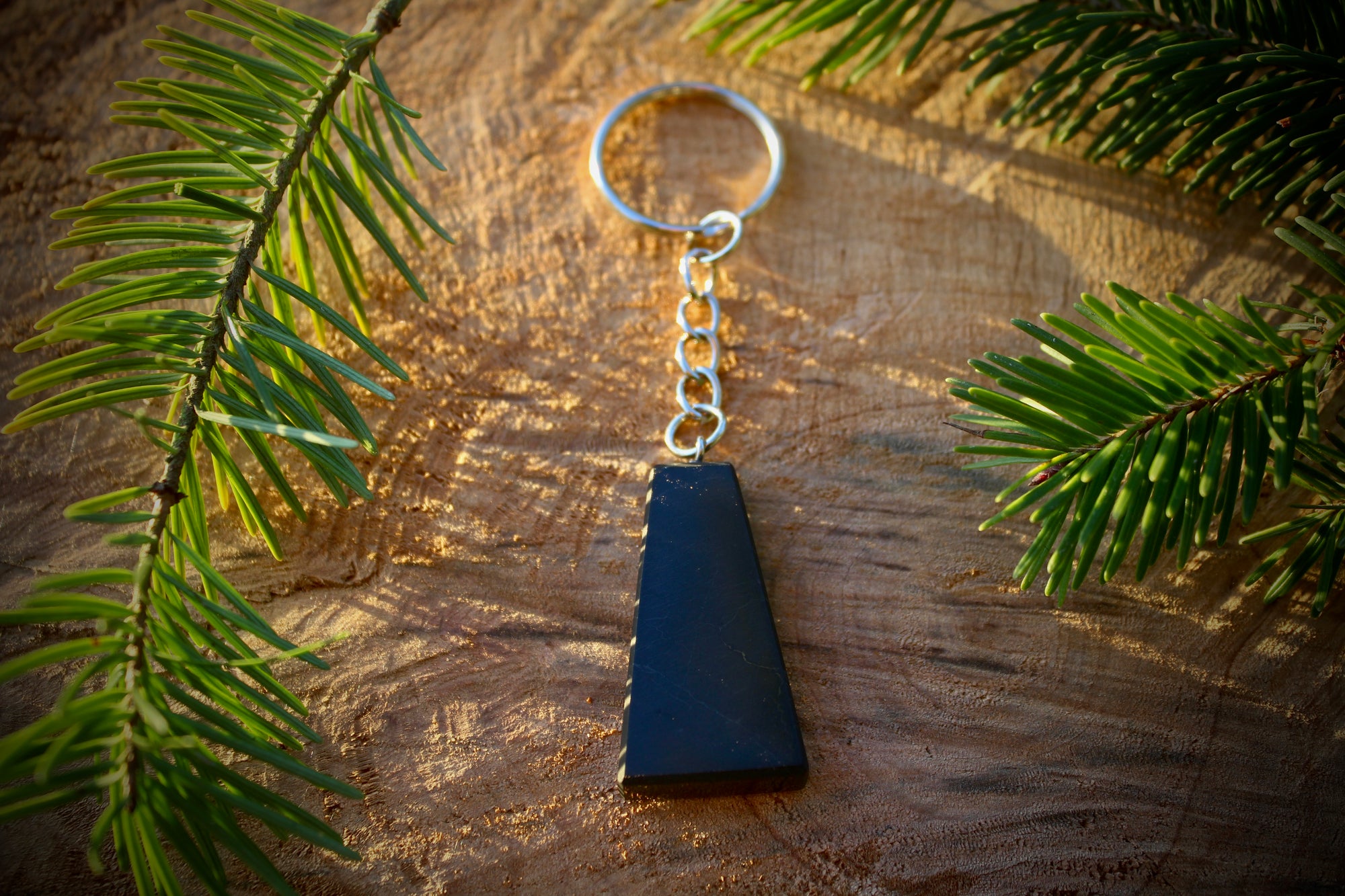 "Trapezoid Shungite keychain featuring a bold, geometric design ideal for stylish EMF protection."